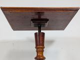 a wooden table with a wooden top and a wooden base