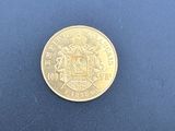 l'image d'une pièce d'or sur un fond bleu