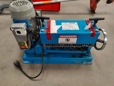 a blue machine that is sitting on the floor