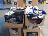 several boxes of clothing are stacked on top of each other