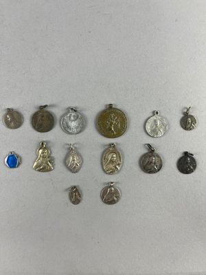 some of the medals are on display on a white surface