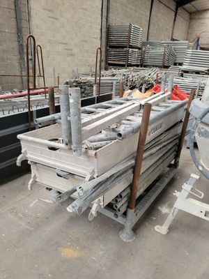 a large pile of metal items in a warehouse