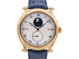 a close up of a wrist watch with a blue strap
