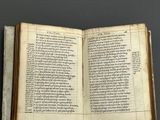 an open book with a page of text on it sitting on top of a table