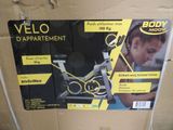 a box with a picture of a woman on a stationary bike
