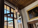 a large window with a view of a building through it