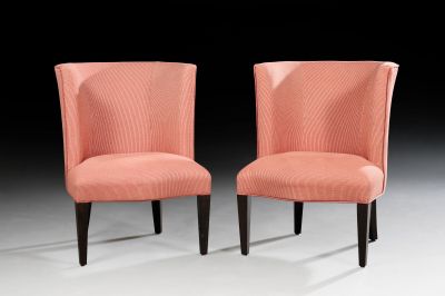 pair of pink upholstered chairs with black legs