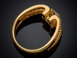 a close up of a gold ring with diamonds on a black background
