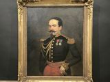 portrait of a man in a military uniform in a gold frame