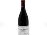 a bottle of wine that is sitting on a table