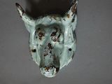 a close up of a horse head on a wall