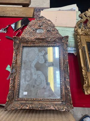 a picture of a woman in a picture frame on a chair