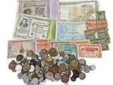 a pile of old foreign currency on a white surface