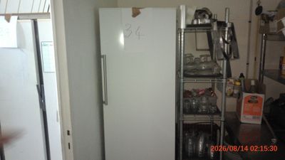 an image of a kitchen with a refrigerator in it