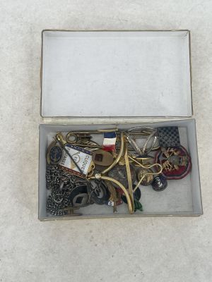 a box with a bunch of keys in it on the floor