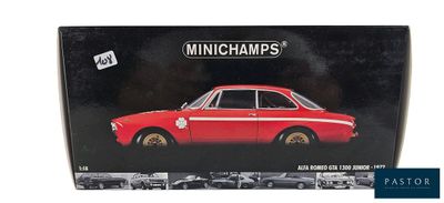 the box is open to show the model of a red car