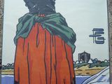 une grande affiche représentant une femme vêtue d'une longue robe rouge