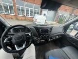 a view of the inside of a vehicle from the driver ' s seat