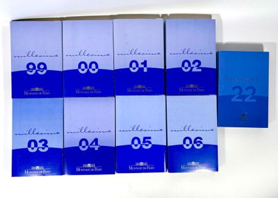 six boxes of blue and white perfumes with the number twenty on them