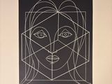 a black and white drawing of a woman ' s face on a wall