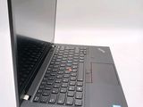 a laptop with a black keyboard on a white surface