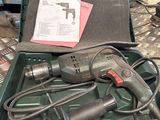 a tool box with a drill and other tools in it