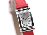 an image of a red strap watch with roman numerals