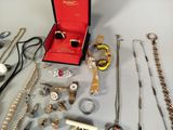 many different types of jewelry sitting on a table