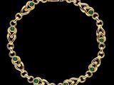 un bracelet en or serti d'émeraudes