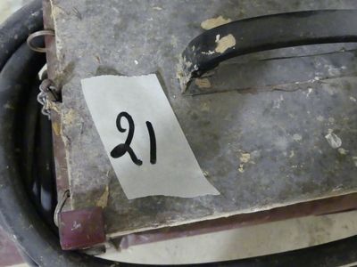 a piece of paper with the letter r on it sitting in a bucket