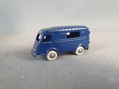 a blue toy bus that is sitting on a table