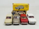 several toy cars are lined up in a row next to a box