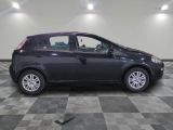 a picture of a black car parked in a garage