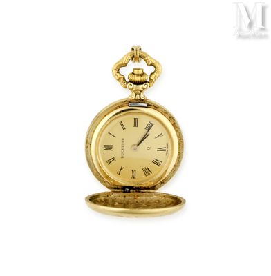 une montre de poche en or avec des chiffres romains