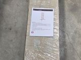 a long piece of cardboard sitting on the floor in a warehouse