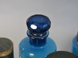 three bottles of perfume sitting next to each other on a table