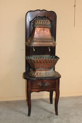a chair that has a stack of bowls on top of it
