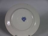 a white plate with a blue design on it