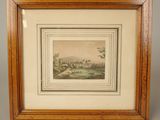 a framed picture of a landscape with a castle in the distance
