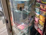 a glass display case with a lot of items inside of it