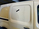 a white van with a black stripe on the side of it