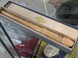 a box that has a knife in it and a clock in it