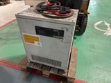a machine that is sitting on a pallet in a warehouse