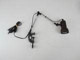 a black lamp that is sitting on a white table