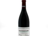 a bottle of wine that is sitting on a table