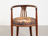 an image of a wooden chair with a floral upholstered seat