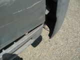 a close up of a truck tire on a gravel road