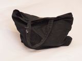 a black bag that is sitting on a white surface