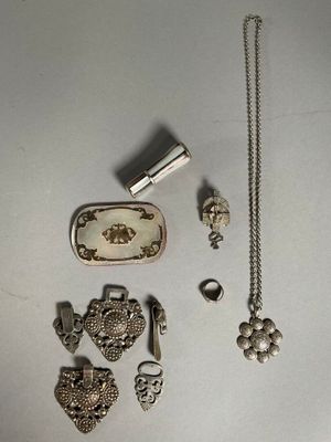 a lot of silver items that are on the table