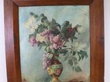 un tableau de fleurs dans un vase sur le mur
